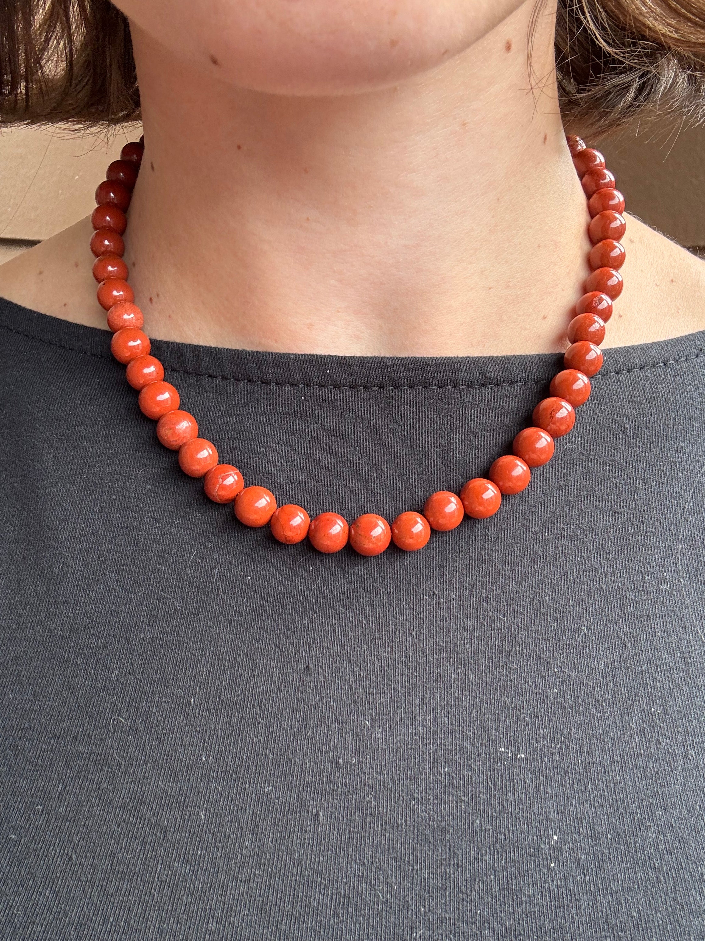 red jasper beaded gemstone necklace on model 