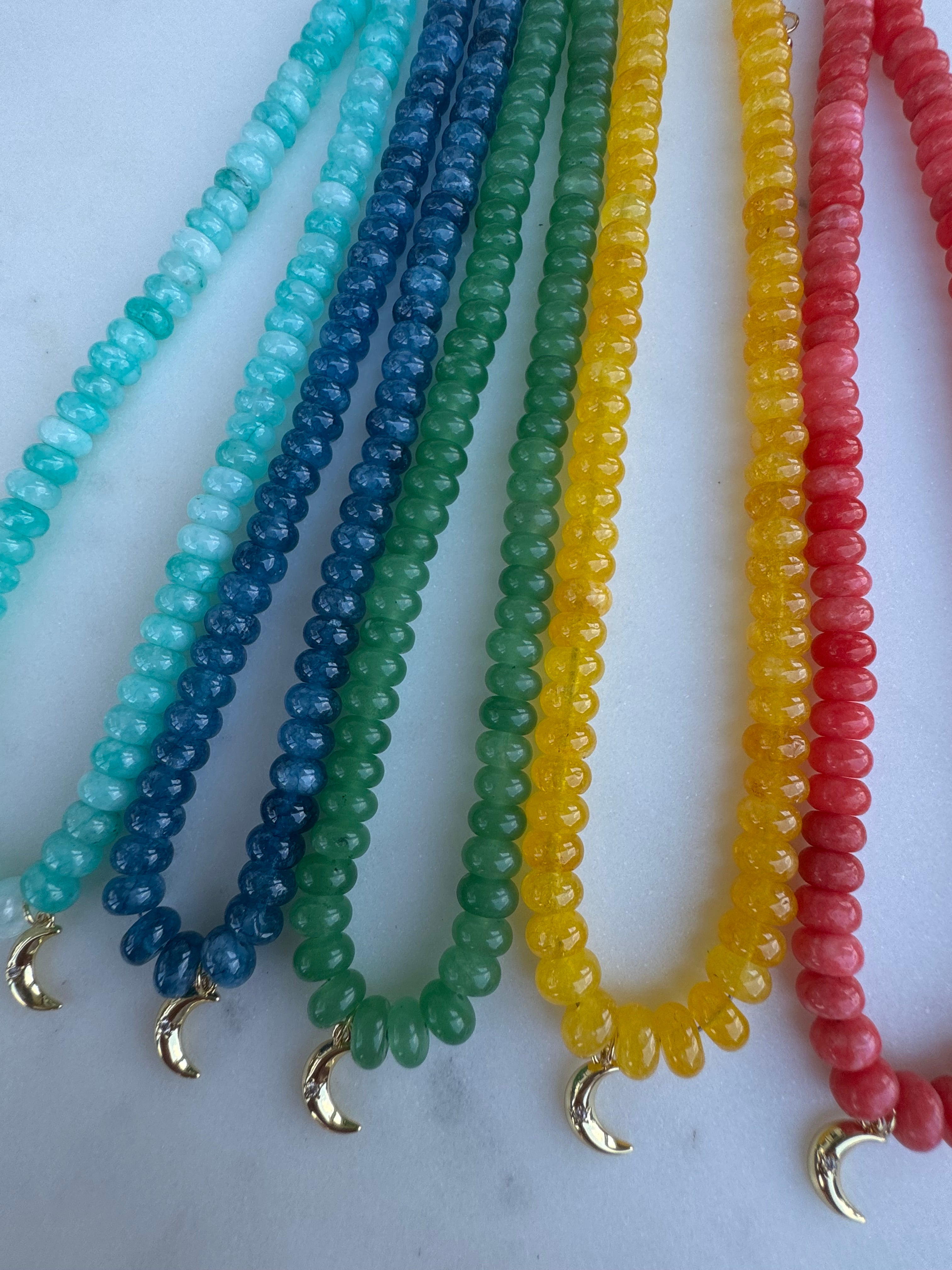 handmade amazonite, kyanite, green quartz, yellow quartz, and cherry quartz necklaces with 14k gold filled moon charms