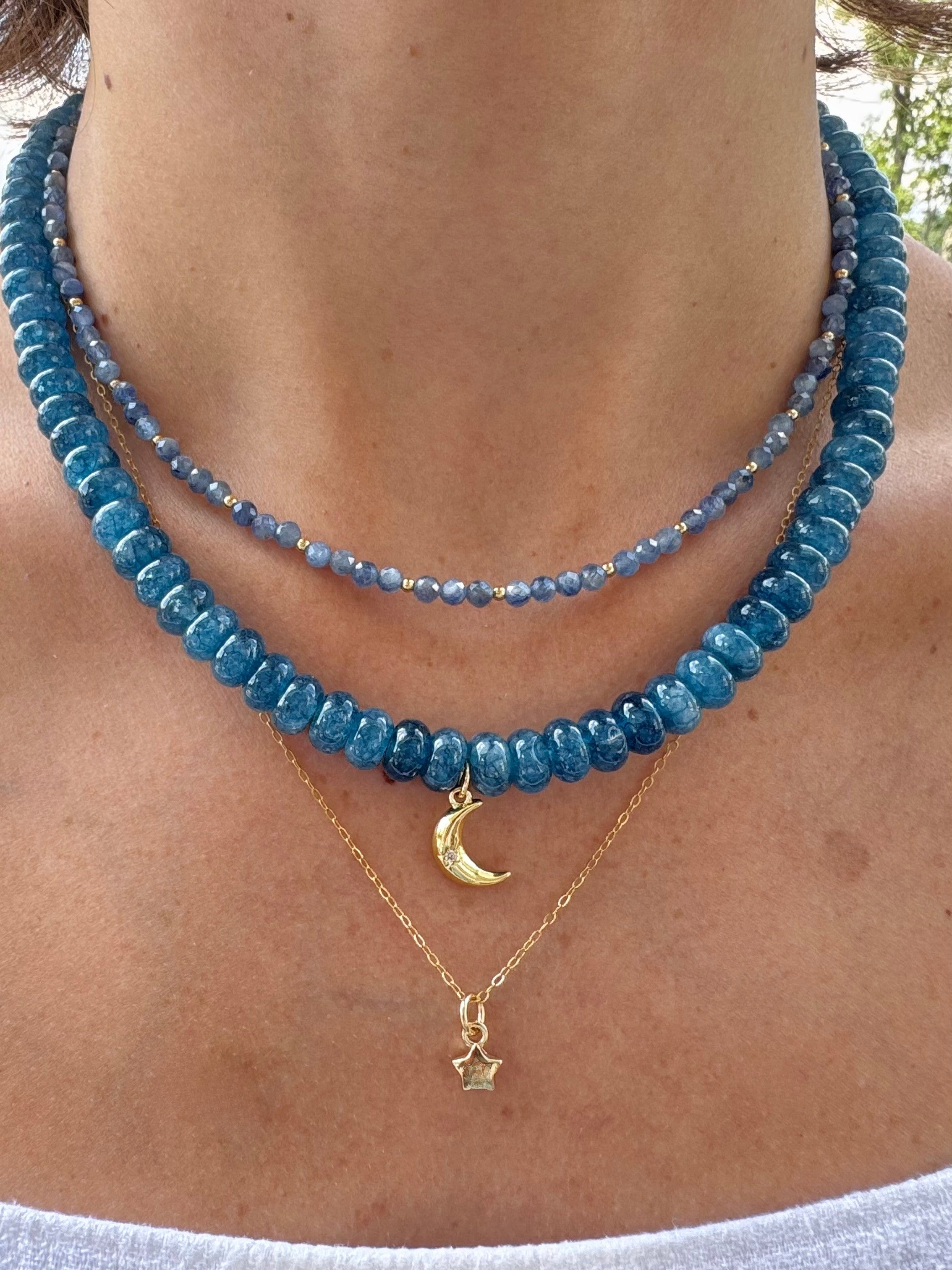 handmade kyanite gemstone necklace, layered on neck with gold star necklace and kyanite stone choker neckalce