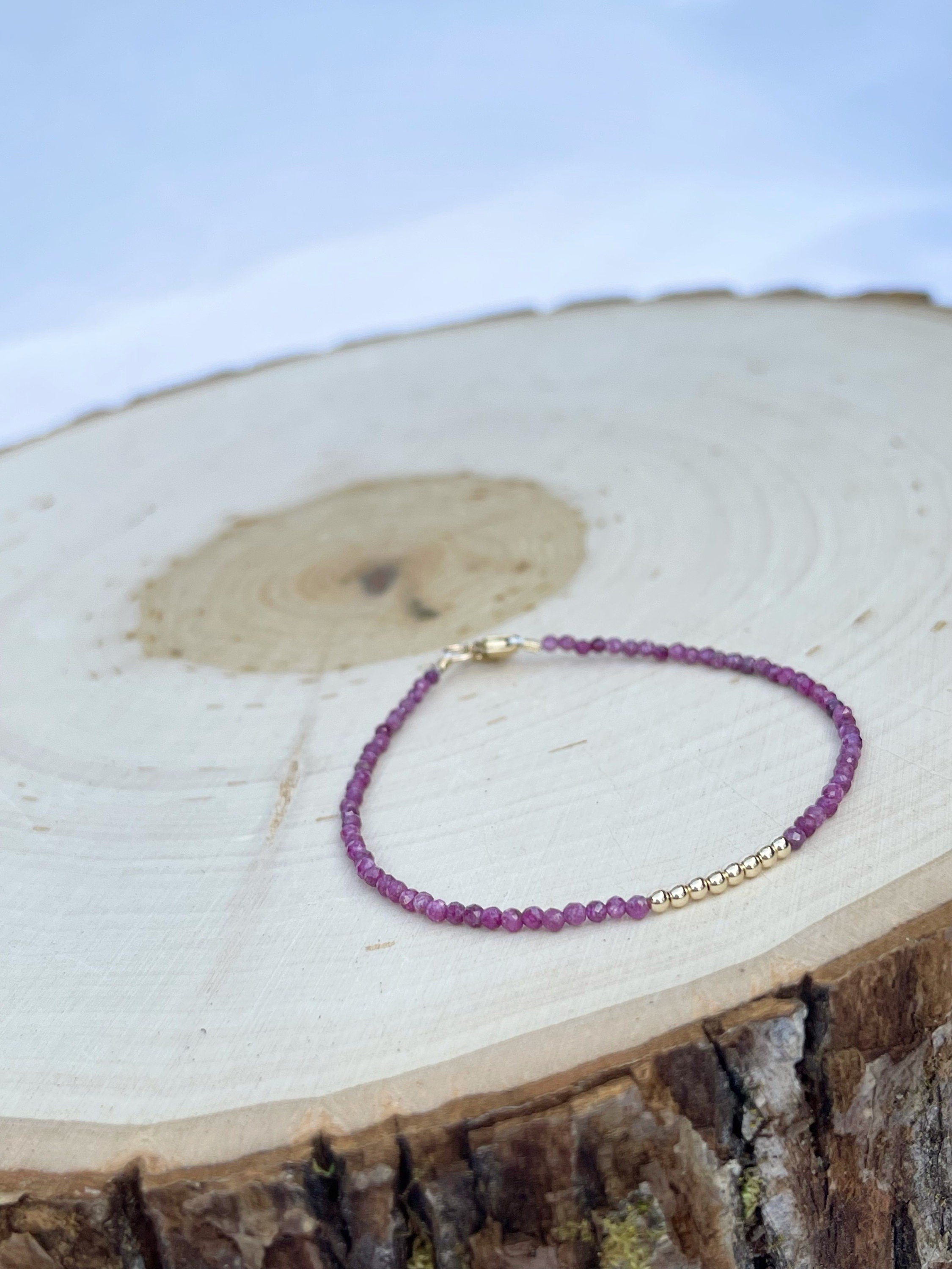 handmade ruby gemstone birthstone bracelet with 14k gold filled. side view